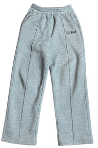 Gray pleated sweatpants with 'EL ROI' logo embroidered on the left leg.